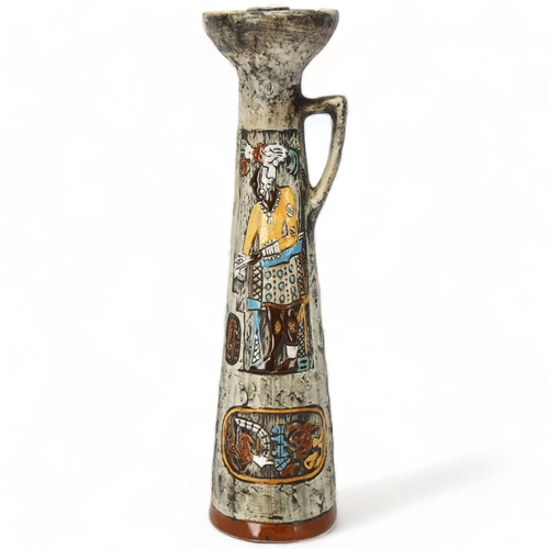 157 - A mid-century Italian Brutalist ceramic candle holder, with painted enamel figures on matt glaze, ma... 