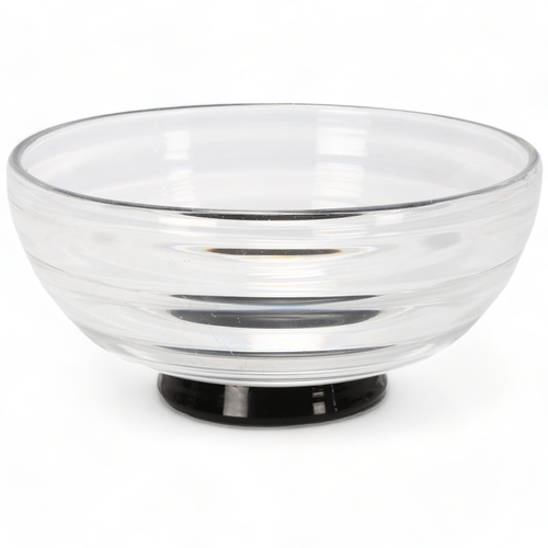 160 - EDWARD HALD for Orrefors, Sweden, a clear glass ribbed bowl on black foot, marked to base Of HU 103,... 