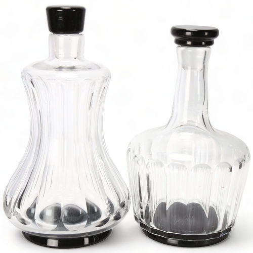 185 - SIMON GATE for Orrefors, two fluted pattern decanters with black glass foot and stopper, 1920s/30s d... 