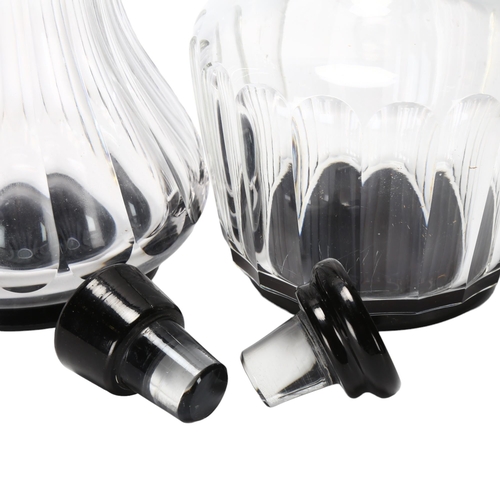 185 - SIMON GATE for Orrefors, two fluted pattern decanters with black glass foot and stopper, 1920s/30s d... 