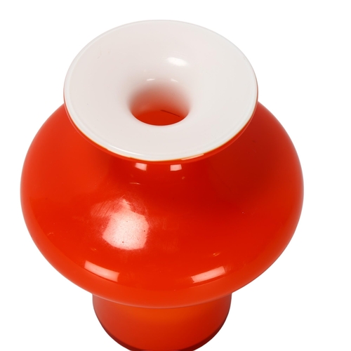 90 - PER LUTKEN for Holmegaard, Denmark, a red cased vase from the Carnaby range, height 15cm