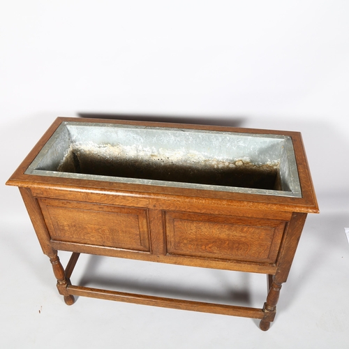 2104 - A Victorian Oak planter with original zinc liner, height 76cm, 97x 43cm