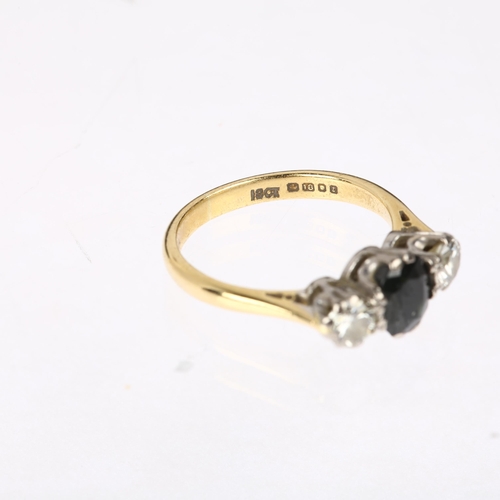 1125 - A late 20th century 18ct gold three stone sapphire and diamond ring, maker EWA, London 1974, claw se... 