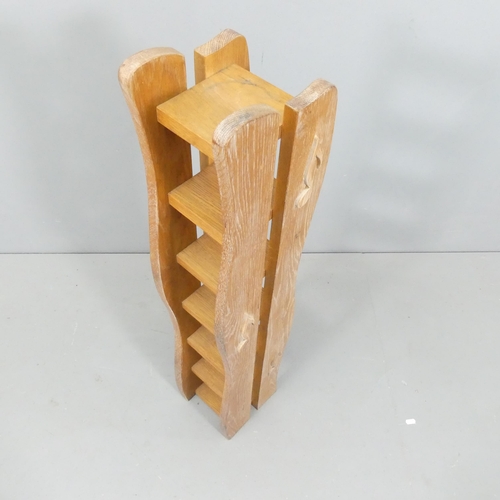 2113 - A limed oak 7-tier shelf, with applied musical note decoration. 20x100x17cm.