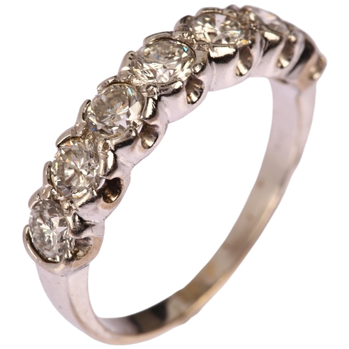 1158 - A modern 18ct white gold seven stone diamond ring, bezel set with modern round brilliant-cut diamond... 