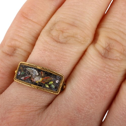 1101 - An Italian Grand Tour micro-mosaic Bird Of Paradise panel ring, circa 1820, the curved rectangular p... 