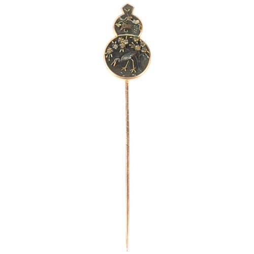 1103 - A Japanese Meiji Period Shakudo 'Crane and Blossom' stickpin, 3-colour gold decoration, unsigned, he... 