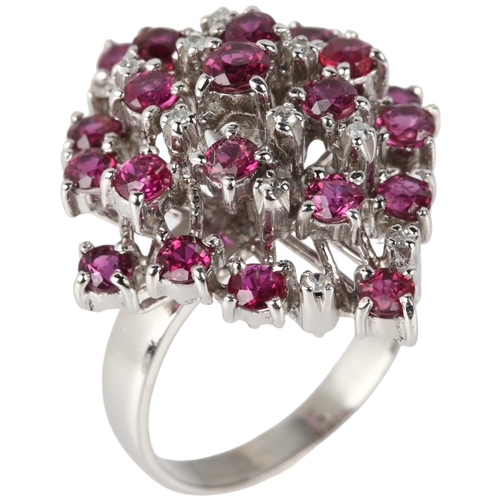 1114 - A large 18ct white gold ruby and diamond marquise cluster cocktail ring, claw set with round-cut rub... 