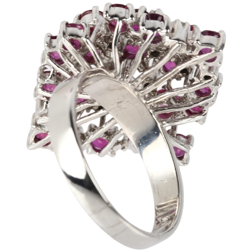 1114 - A large 18ct white gold ruby and diamond marquise cluster cocktail ring, claw set with round-cut rub... 