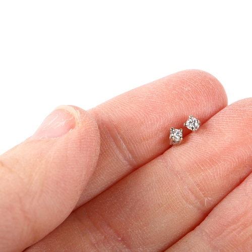 1118 - A pair of 18ct white gold 0.06ct solitaire diamond earrings, each claw set with 0.03ct modern round ... 