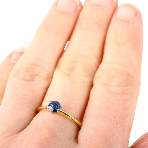 1119 - An 18ct gold solitaire sapphire ring, maker C&JS, London 1998, claw set with 0.5ct round-cut sapphir... 