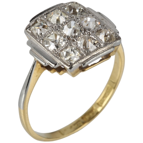 1123 - An 18ct gold nine stone diamond chequer board panel ring, circa 1910, pave set with old-cut diamonds... 