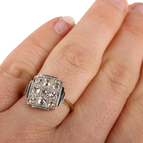 1123 - An 18ct gold nine stone diamond chequer board panel ring, circa 1910, pave set with old-cut diamonds... 