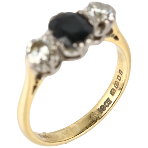 1125 - A late 20th century 18ct gold three stone sapphire and diamond ring, maker EWA, London 1974, claw se... 