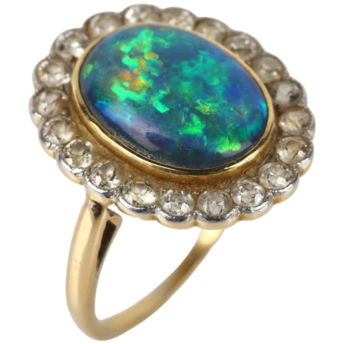 1130 - A black opal and diamond oval cluster ring, mid-20th century, rub-over set with 2.5ct oval cabochon ... 