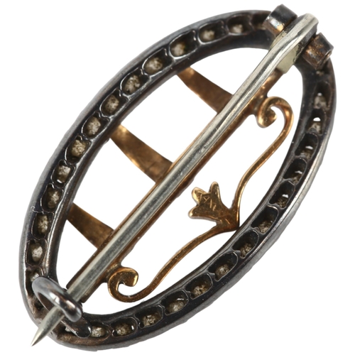 1135 - A Georgian silver and gold diamond buckle brooch, cut-down collet set with old-cut diamonds, 25mm, 3... 