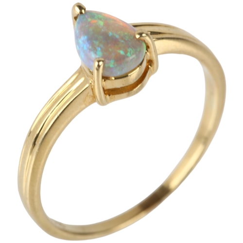 1136 - A modern 14ct gold solitaire opal ring, claw set with pear cabochon opal, opal measures approx 6.84 ... 