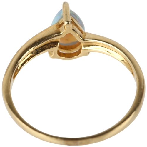 1136 - A modern 14ct gold solitaire opal ring, claw set with pear cabochon opal, opal measures approx 6.84 ... 