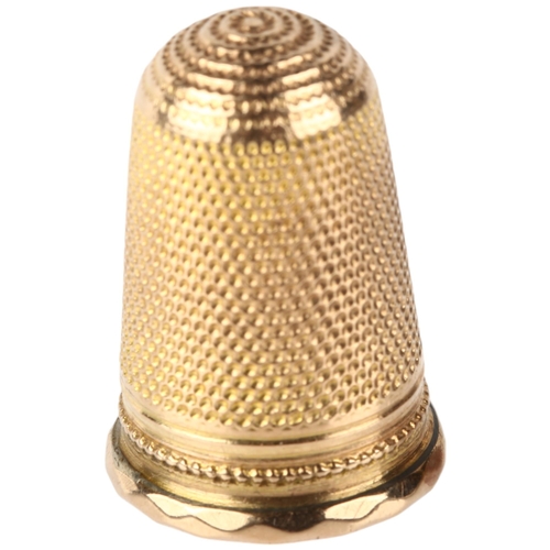 1142 - An Antique unmarked gold sewing thimble, with applied shield motif, 23.4mm, 4.6g