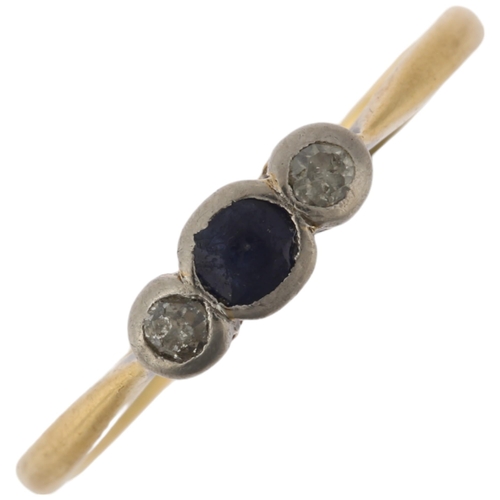 1143 - An early 20th century 18ct gold three stone sapphire and diamond ring, total diamond content approx ... 