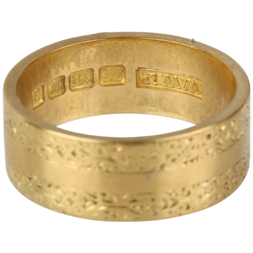 1147A - A mid-20th century 18ct gold wedding band ring, maker WW Ltd, London 1956, engraved foliate decorati... 