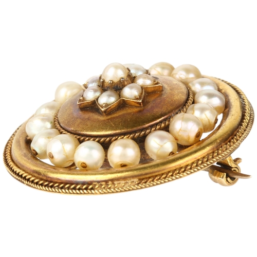 1159 - A Victorian whole pearl flowerhead cluster mourning brooch, circa 1880, circular form with central f... 