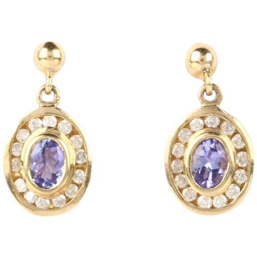 1160 - A pair of 9ct gold tanzanite and diamond oval cluster drop earrings, rub-over set with oval mixed-cu... 