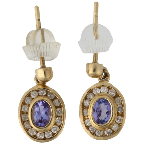 1160 - A pair of 9ct gold tanzanite and diamond oval cluster drop earrings, rub-over set with oval mixed-cu... 