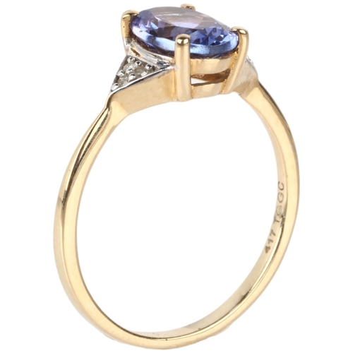 1161 - A modern 9ct gold tanzanite and diamond dress ring, claw set with oval mixed-cut tanzanite and singl... 