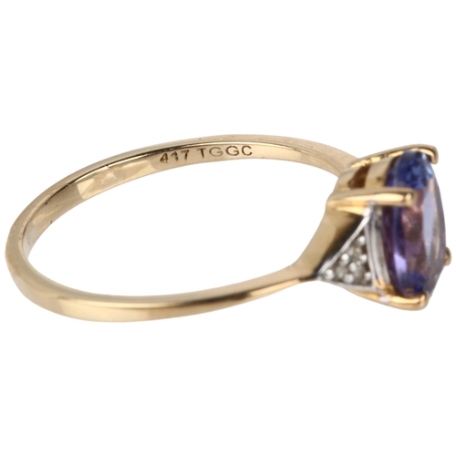 1161 - A modern 9ct gold tanzanite and diamond dress ring, claw set with oval mixed-cut tanzanite and singl... 