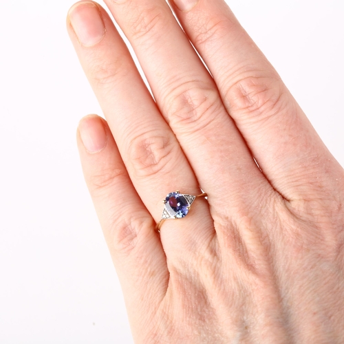 1161 - A modern 9ct gold tanzanite and diamond dress ring, claw set with oval mixed-cut tanzanite and singl... 