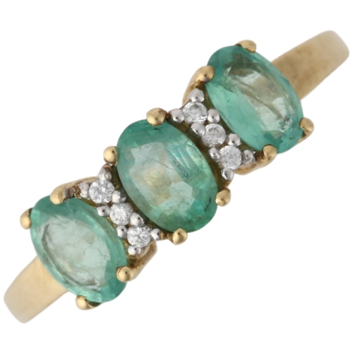 1162 - A modern 9ct gold emerald and cubic zirconia half hoop ring, claw set with oval mixed-cut emeralds a... 