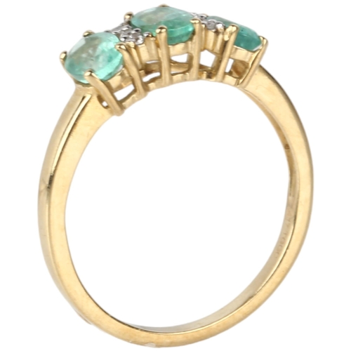 1162 - A modern 9ct gold emerald and cubic zirconia half hoop ring, claw set with oval mixed-cut emeralds a... 