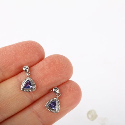 1163 - A pair of 9ct white gold tanzanite drop earrings, rub-over set with trillion-cut tanzanites, with st... 