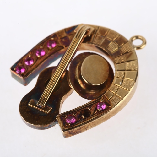 1164 - A novelty ruby horse shoe guitar and hat pendant, apparently unmarked, 25.2mm, 2.7g