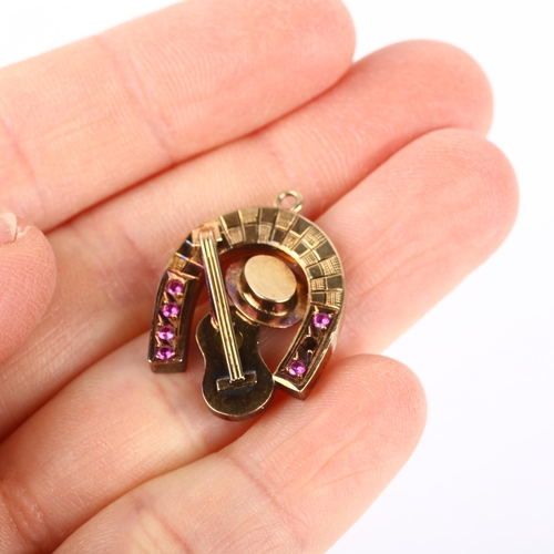 1164 - A novelty ruby horse shoe guitar and hat pendant, apparently unmarked, 25.2mm, 2.7g