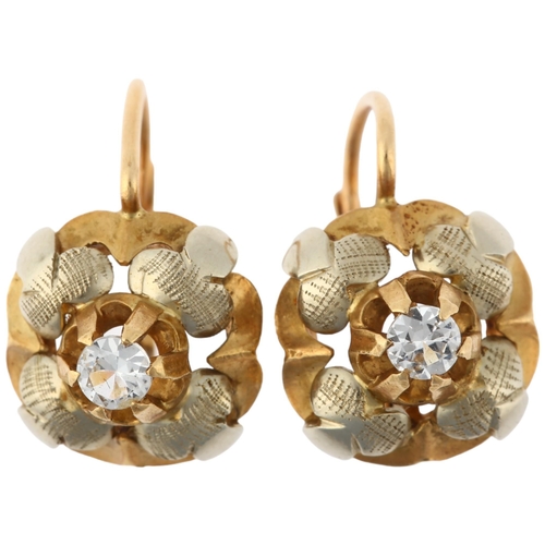 1165 - A pair of 18ct gold white sapphire flowerhead earrings, with English lock fittings, 11.6mm, 4.3g