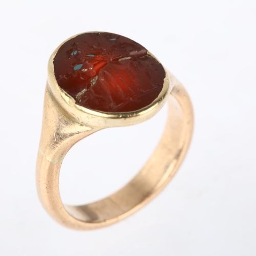 1167 - A Roman carnelian intaglio ring stone, carved depicting 2 figures beneath stars holding staffs, appa... 