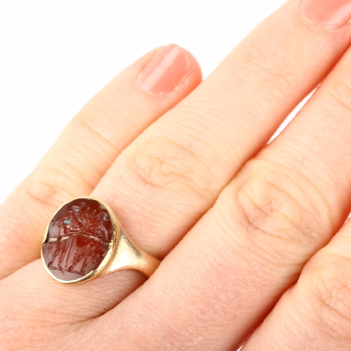 1167 - A Roman carnelian intaglio ring stone, carved depicting 2 figures beneath stars holding staffs, appa... 