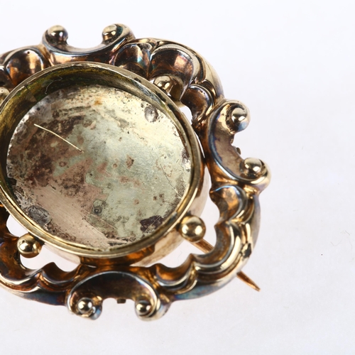 1168 - A 19th century mourning brooch frame, central vacant panel with foliate border and closed-back unmar... 