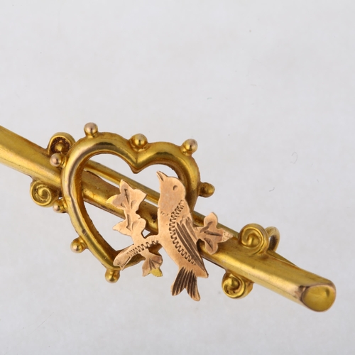 1172 - An Edwardian 9ct two-colour gold sweetheart bar brooch, circa 1905, with bird and heart motif, 34.5m... 