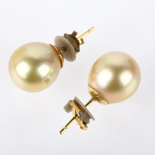 1174 - A pair of 18ct gold whole South Sea pearl earrings, with stud fittings, 10.4mm pearls, 4.1g