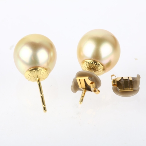 1174 - A pair of 18ct gold whole South Sea pearl earrings, with stud fittings, 10.4mm pearls, 4.1g