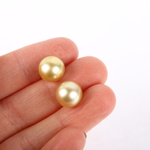 1174 - A pair of 18ct gold whole South Sea pearl earrings, with stud fittings, 10.4mm pearls, 4.1g