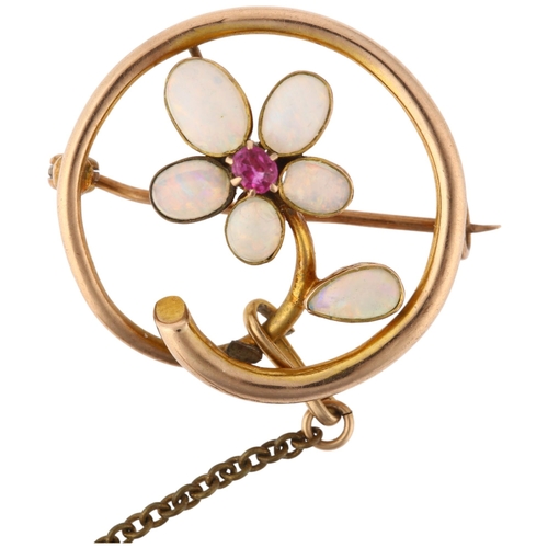 1175 - An Edwardian 9ct rose gold opal and ruby floral openwork brooch, circa 1905, 23.7mm, 2.5g