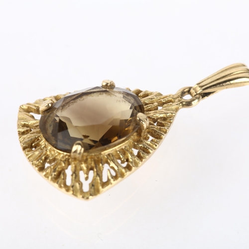 1176 - A 1970s 9ct gold smoky quartz naturalistic drop pendant, maker G&TJ, London 1971, claw set with oval... 