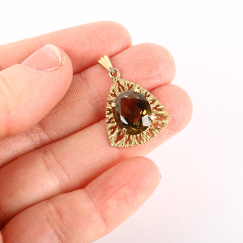 1176 - A 1970s 9ct gold smoky quartz naturalistic drop pendant, maker G&TJ, London 1971, claw set with oval... 