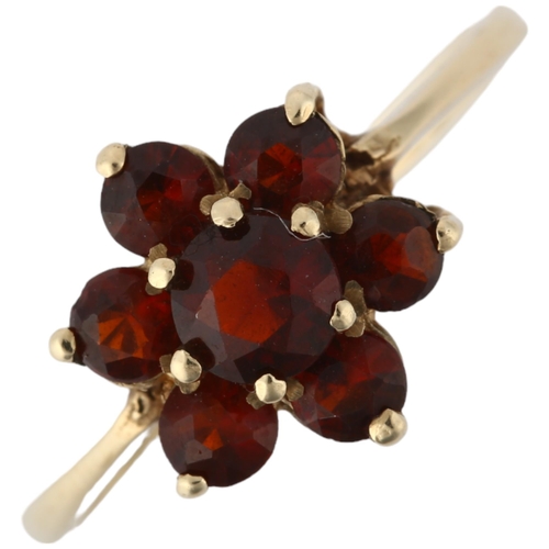 1180 - A 9ct gold garnet flowerhead cluster ring, London 1979, setting height 10.7mm, size P, 1.7g