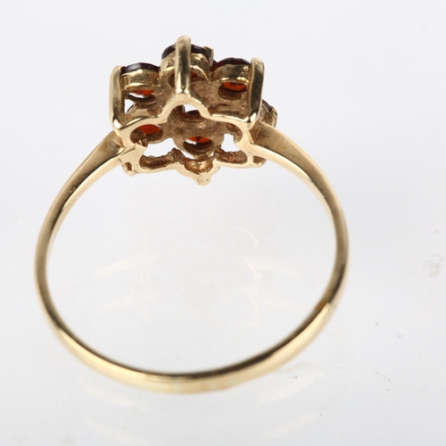 1180 - A 9ct gold garnet flowerhead cluster ring, London 1979, setting height 10.7mm, size P, 1.7g