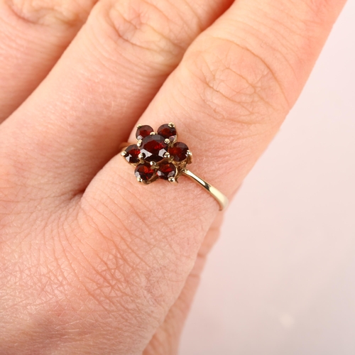 1180 - A 9ct gold garnet flowerhead cluster ring, London 1979, setting height 10.7mm, size P, 1.7g